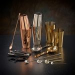 A promotional barware products like golden, silver and platinum color glass, with spoons and other bar items by Faddico.