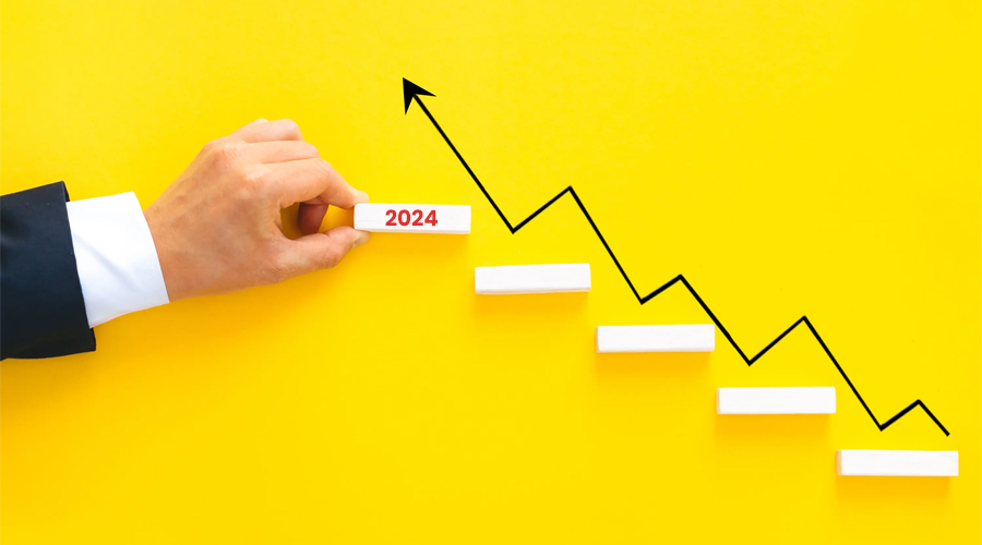 A man is making the sales graph on yellow wall.