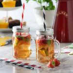 a beautiful mugs with straws are filled with liquid. An customized promotional drinkware straw mugs by Faddico.