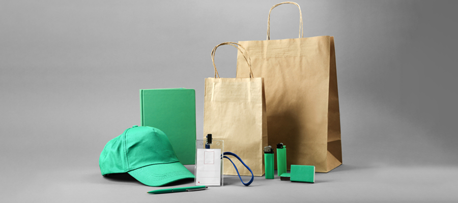 A promotional product like green cap, Eco-friendly bags and transparent card case are placed well to show the strength of holiday promotional strategies.