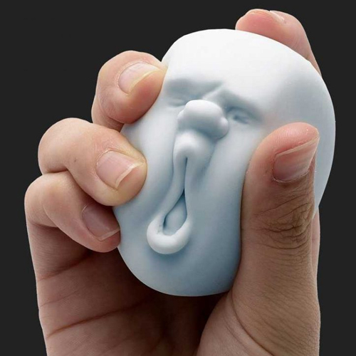 A man is plaining with cute stress ball promotional health product by Faddico in light blue color.