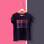 A logo-printed T-shirt made by Faddico for events promotion hanging on a wall.