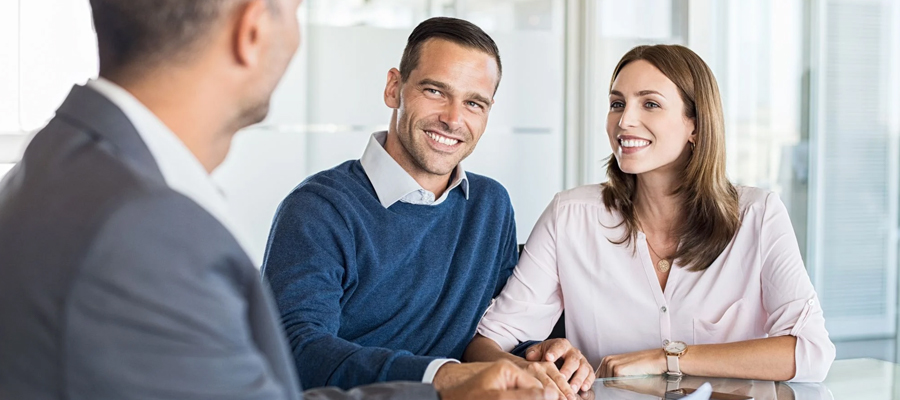 The owner of a small business is smiling after knowing the benefits of brand merchandising.