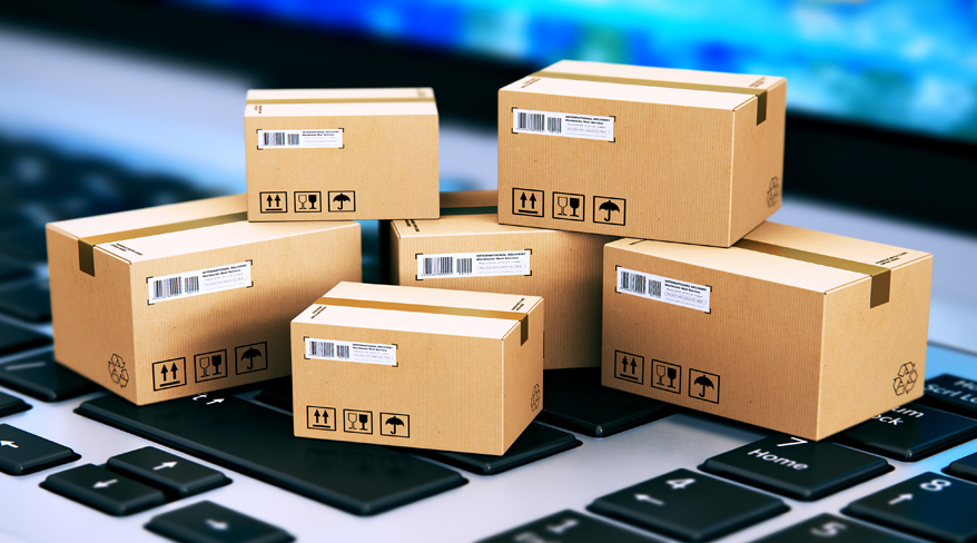 Small sample boxes are placed on top of a laptop, showcasing the bulk order benefits by demonstrating how multiple items can be efficiently organized and stored together.