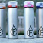 Customized water bottles with an 'F' logo neatly arranged in one place, an excellent outdoor and leisure promotional product.