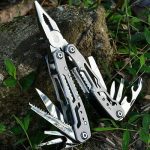 A multitool gadget placed on the ground.