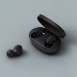 Black earbuds are placed open next to their pod.