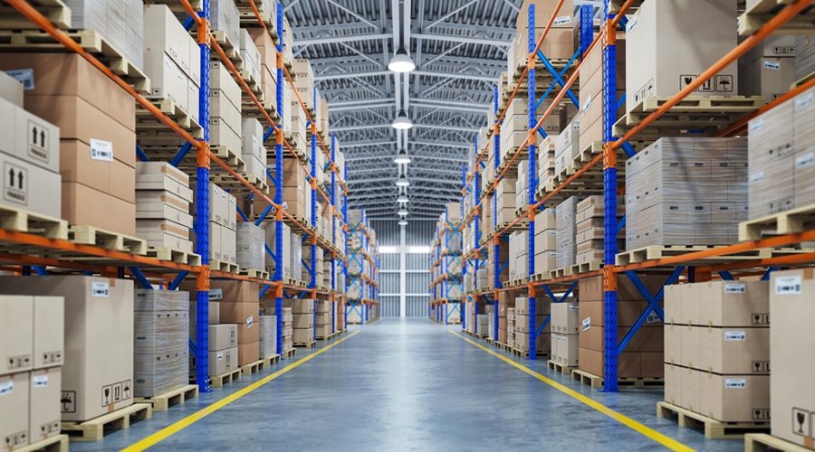 Benefits of Warehousing-Symmetrical view with rows of high shelving stacked with cardboard boxes.